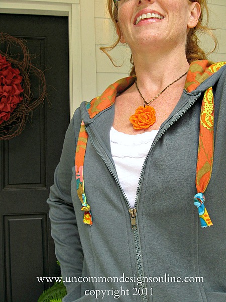 Adorable sweatshirt update with beautiful fabric! Take a plain hoodie up a notch and create this fun and stylish fabric lined hoodie. #sewing #fabric #annamariahorner #hoodie #refashion