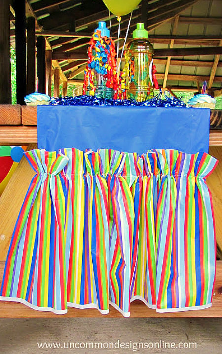 What a great idea...Make an Easy and Inexpensive Table Runner out of Plastic Tablecloths!  Perfect for any occassion!  www.uncommondesignsonline.com #partyplanning  #partyideas