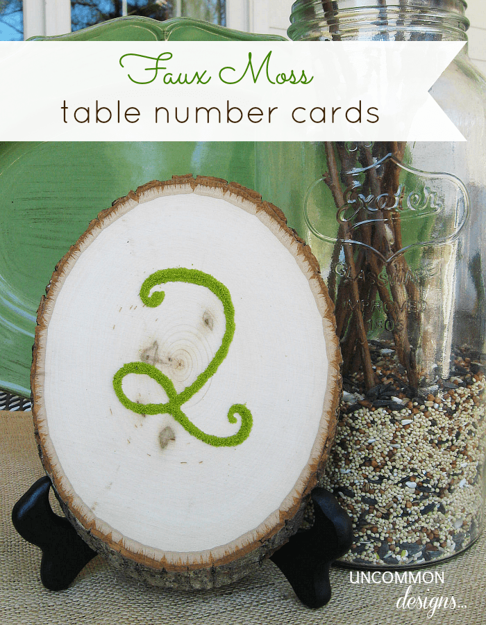 DIY Faux Moss Table Number Cards. Use slices of wood and a great faux moss product to create these. #weddingideas #moss #tablecards