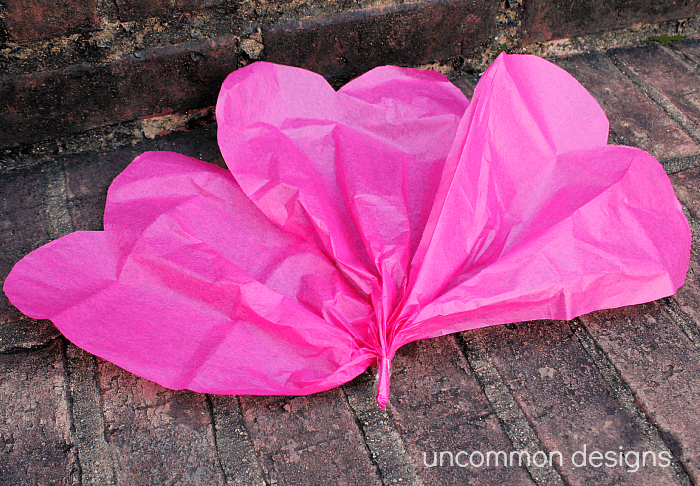 Such a cool and easy craft... make giant tissue paper flowers! www.uncommondesignsonline.com #tissuepoms #partyplanning 