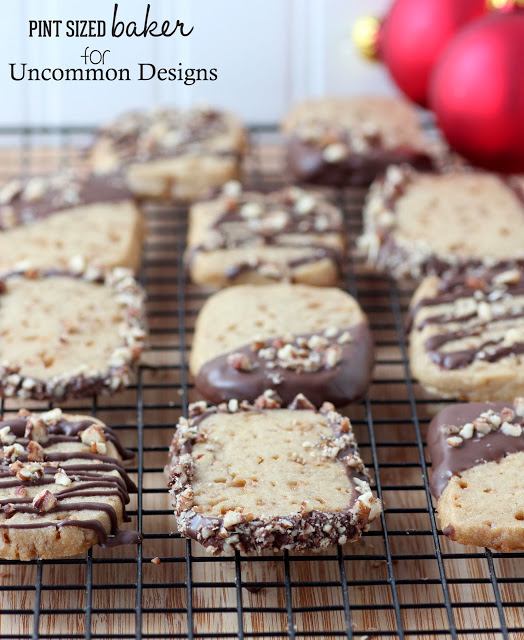 Chocolate Dipped Toffee Cookies... The yummiest sweet treat you have ever given!  #Christmas  #Cookies  via www.uncommondesignsonline.com