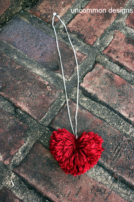 DIY Pom Pom Heart Necklace... a cute and easy Valentine's craft. via www.uncommondesignsonline.com #PomPom #ValentinesDay