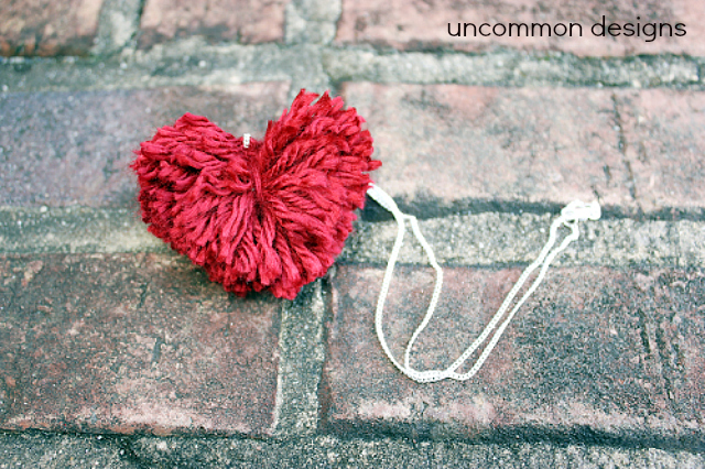 DIY Pom Pom Heart Necklace... a cute and easy Valentine's craft.  via www.uncommondesignsonline.com #PomPom  #ValentinesDay