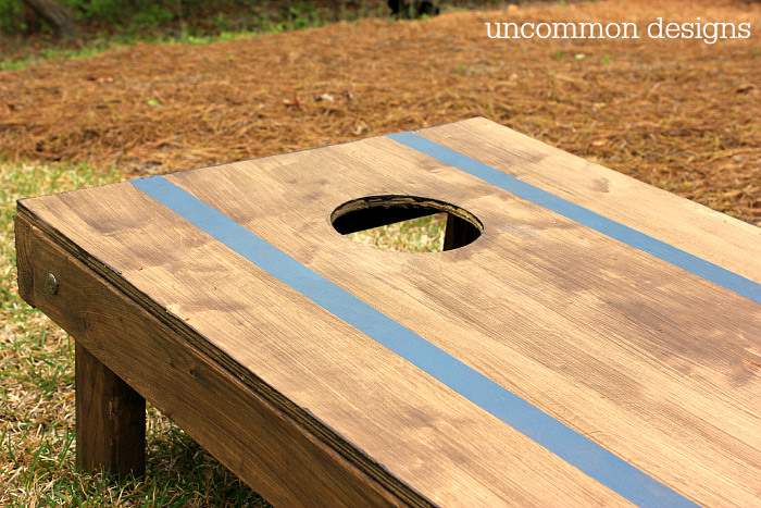 How to Customize a Cornhole Board #FrogTape #ad www.uncommondesignsonline.com