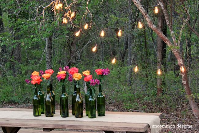 Make an Easy and Elegant Floral Centerpiece out of Wine Bottles! Perfect for weddings, bridal showers, and parties! www.uncommondesignsonline.com #WeddingCenterpiece #OutdoorEntertaining