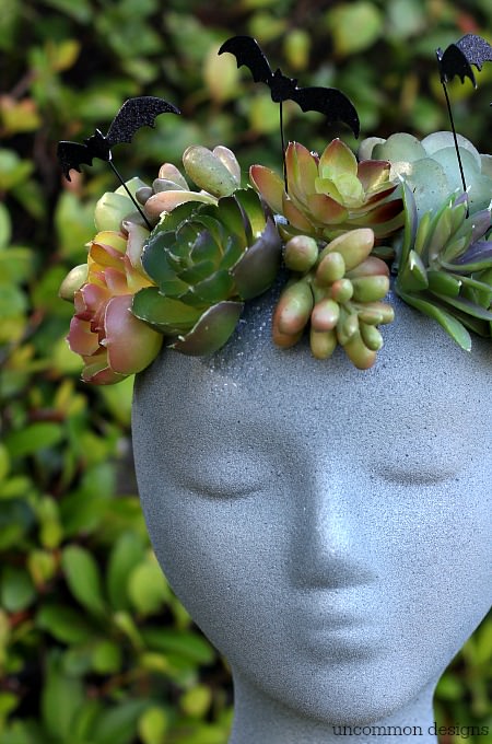 Make a faux Halloween Goddess Sculpture with a foam wig head.  Such a unique Halloween decoration! via Uncommon Designs