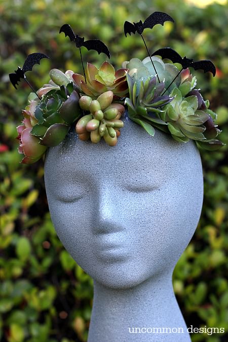 Make a faux Halloween Goddess Sculpture with a foam wig head.  Such a unique Halloween decoration! via Uncommon Designs