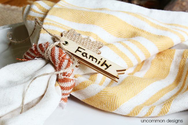 DIY Thanksgiving Napkin Rings for a beautiful fall or thanksgiving table. Burn words into wooden tags for a personalized touch. A simple way to add a fun touch to your fall decorations via Uncommon Designs