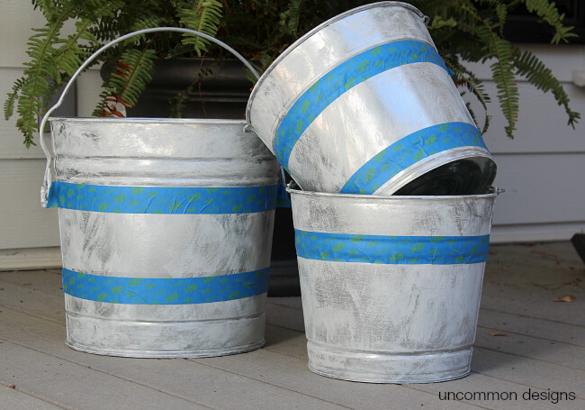 Create beautiful Vintage Stripe Aged Galvanized Buckets via Uncommon Designs for a rustic holiday decor style. #thehomedepot #3MPartner