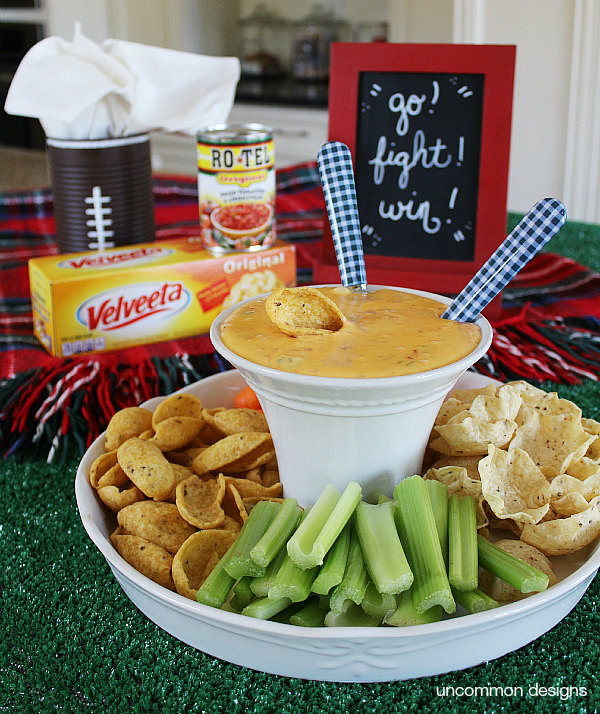 Create a simple 2 ingredient Queso with RO*TEL and VELVETTA. We even created a fun dipping station via Uncommon Designs.