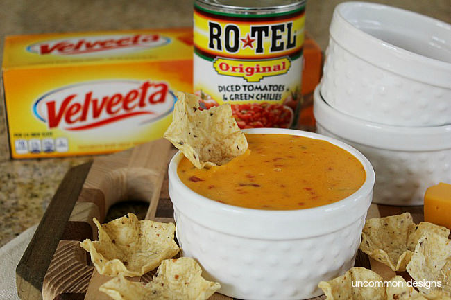 Create a simple 2 ingredient Queso with RO*TEL and VELVETTA. We even created a fun dipping station via Uncommon Designs.