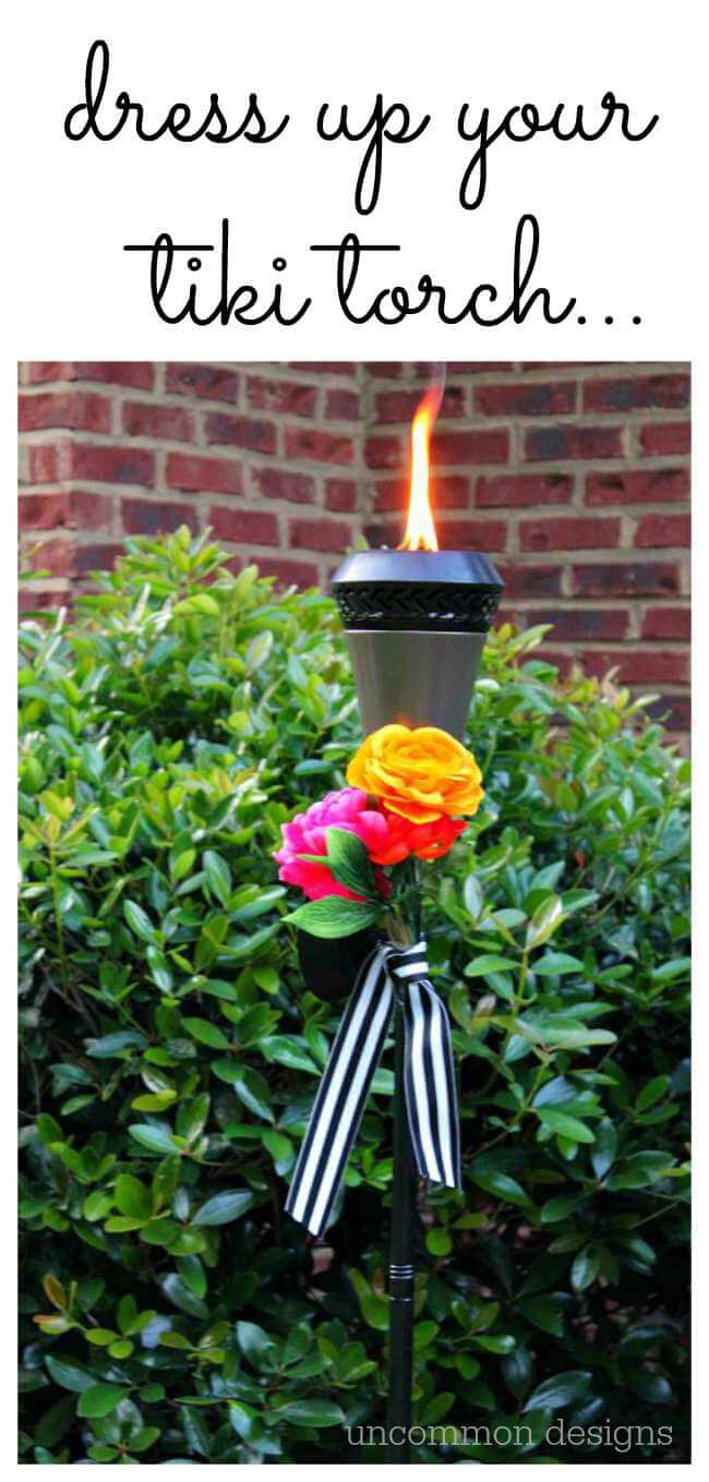 Dress up your tiki torches.  These floral tiki torches would be gorgeous for a wedding or garden party.  Add a few faux flowers and some striped ribbon and you are done! by Uncommon Designs 