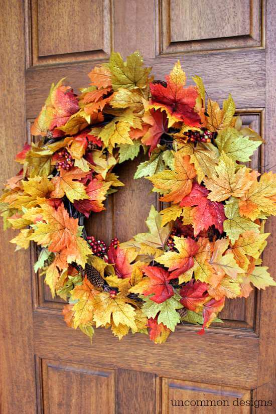 Make a fall leaf wreath in just minutes! Grab a few garlands and a grapevine wreath and you can create this beauty with Uncommon Designs 