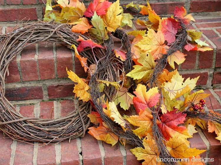 Make a fall leaf wreath in just minutes! Grab a few garlands and a grapevine wreath and you can create this beauty with Uncommon Designs 