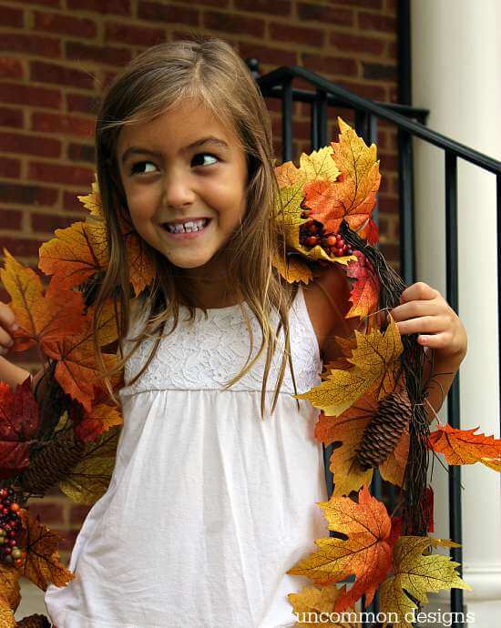 Make a fall leaf wreath in just minutes! Grab a few garlands and a grapevine wreath and you can create this beauty with Uncommon Designs 