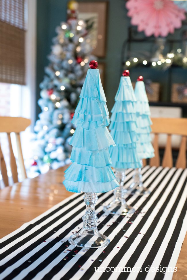 Coffee Filter Christmas Trees are the easiest Christmas decoration you will make this year! Grab some coffee filters and a little paint... the perfect kids holiday craft! | Uncommon Designs