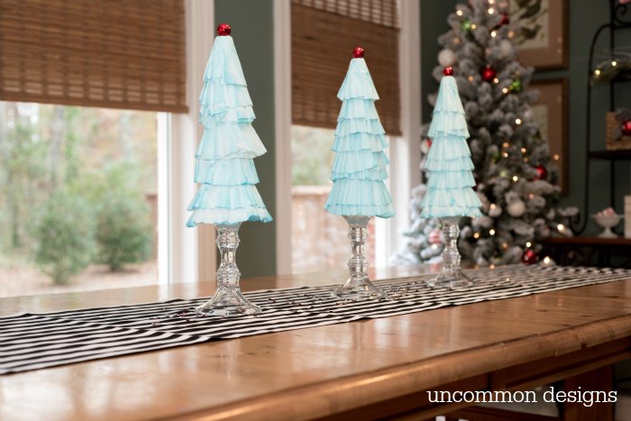 Coffee Filter Christmas Trees are the easiest Christmas decoration you will make this year! Grab some coffee filters and a little paint... the perfect kids holiday craft! | Uncommon Designs