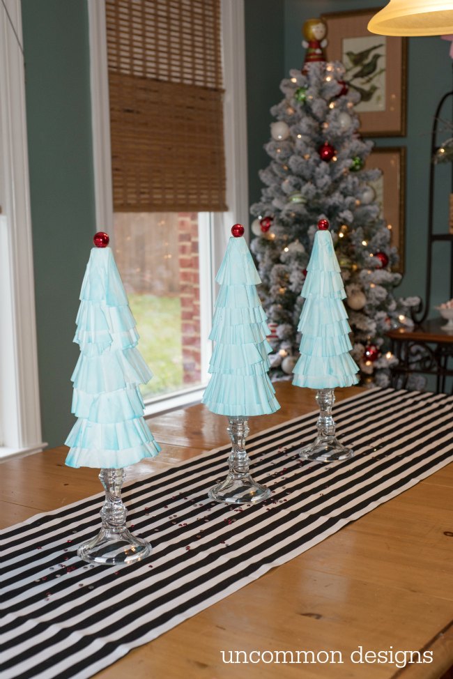Coffee Filter Christmas Trees are the easiest Christmas decoration you will make this year! Grab some coffee filters and a little paint... the perfect kids holiday craft! | Uncommon Designs