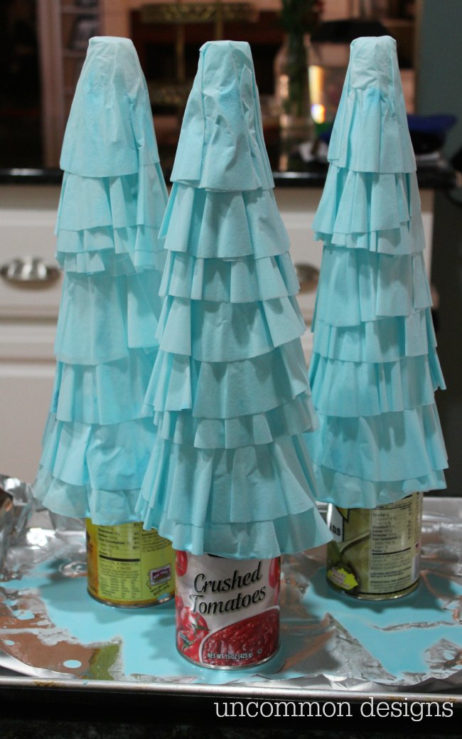 Coffee Filter Christmas Trees are the easiest Christmas decoration you will make this year! Grab some coffee filters and a little paint... the perfect kids holiday craft! | Uncommon Designs