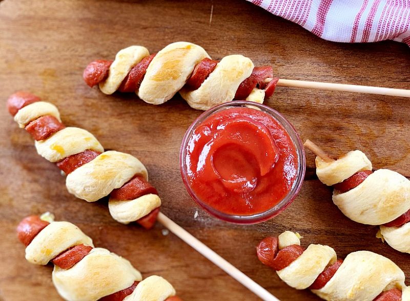 Tornado Dogs | Hot Dogs on a stick with a twist. Amp up the summer fun with this hot dog recipe for an easy dinner idea. With only a few ingredients and Hunt's Best Ever Ketchup, dinner is yummy and fun! 