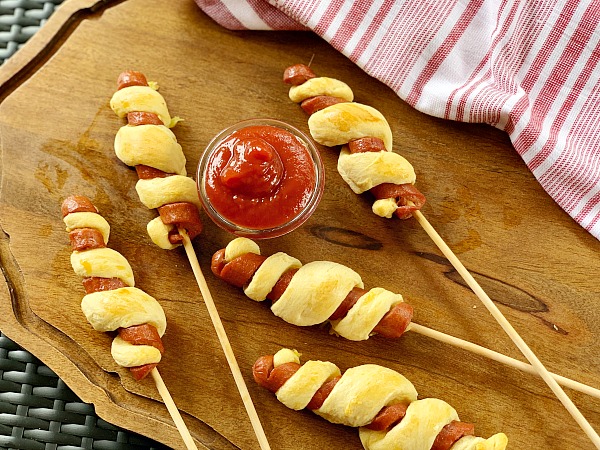 Tornado Dogs | Hot Dogs on a stick with a twist. Amp up the summer fun with this hot dog recipe for an easy dinner idea. With only a few ingredients and Hunt's Best Ever Ketchup, dinner is yummy and fun! 